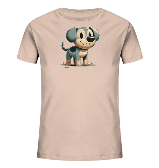 Onlineshop Shirts fuer Kinder - Das Bild zeigt ein hellrosafarbenes T-Shirt mit einer niedlichen Cartoon-Illustration eines Hundes auf der Vorderseite. Der Hund ist grau und beige mit schwarzen Flecken, hat grosse Ohren und ein freundliches Laecheln. Er steht auf einer stilisierten Rasenflaeche dargestellt und verleiht dem Shirt einen verspielten Charakter.