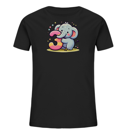 Onlineshop Shirts fuer Kinder - Das Bild zeigt ein schwarzes Kinder-T-Shirt mit einem niedlichen Aufdruck. Ein freundlicher, cartoonartiger Elefant haelt eine grosse, bunt gestreifte Zahl '3' fest. Um das Motiv herum sind spielerisch farbige Punkte verteilt. Das Design wirkt froehlich und kindgerecht.