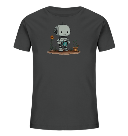 Onlineshop Shirts für Kinder - Das Bild zeigt ein dunkelgraues T-Shirt mit einem detailreichen Aufdruck auf der Vorderseite. Zu sehen ist ein kleiner, freundlich aussehender Roboter mit großen Augen und Kopfhörern, der eine blaue Gießkanne hält. Der Roboter steht auf brauner Erde neben einer hohen orangefarbenen Blume und einer kleineren Pflanze in einem Topf. Die Grafik ist im Cartoon-Stil gehalten und wirkt verspielt.