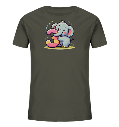 Onlineshop Shirts fuer Kinder - Das Bild zeigt ein dunkelgraues Kinder-T-Shirt mit einem niedlichen Cartoon-Elefanten auf der Vorderseite. Der Elefant haelt eine grosse, bunte Zahl '3' fest, die pink und gelb gestreift ist. Kleine bunte Punkte umgeben die Szene, die auf einem gelblichen Untergrund spielt. Das Motiv wirkt froehlich und kindgerecht.