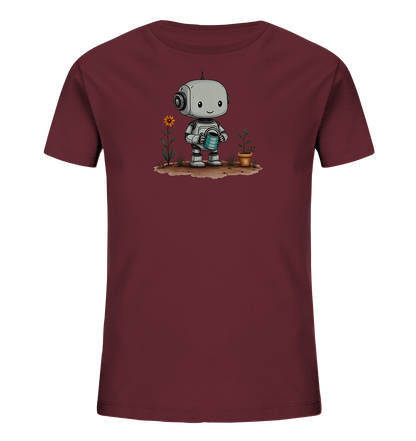 Onlineshop Shirts für Kinder - Das Bild zeigt ein dunkelrotes T-Shirt für Kinder mit einem detaillierten Grafikdruck auf der Vorderseite. Die Grafik stellt einen freundlichen, cartoonartigen Roboter dar, der auf einem Stück Erde steht. Der Roboter hält eine blaue Gießkanne und gießt damit eine kleine Pflanze in einem braunen Topf. Neben dem Roboter wächst eine weitere Pflanze mit einer auffälligen gelben Blume, was dem Motiv eine naturfreundliche Note verleiht.