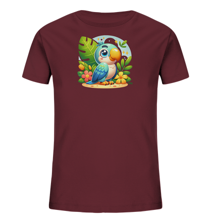 Onlineshop Shirts fuer Kinder - Das Bild zeigt ein Kindershirt in dunklem Bordeauxrot mit einem lustigen Papagei-Motiv auf der Vorderseite. Ein cartoonartiger blauer Vogel sitzt inmitten von Blaettern und Blumen auf einer Sandflaeche. Ein heller Kreis mit Sternen bildet den Hintergrund des farbenfrohen Designs.