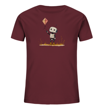 Onlineshop Shirts für Kinder - Das Bild zeigt ein Kinder-T-Shirt in einem dunklen Burgunder- oder Marronton. Auf der Vorderseite ist eine liebenswerte Illustration eines kleinen, lächelnden Roboters zu sehen. Der Roboter hält die Schnur eines kleinen, rautenförmigen Drachens in die Höhe. Unter dem Roboter ist eine stilisierte Wiese mit Grashalmen und kleinen Pflanzen dargestellt. Das Design wirkt fröhlich und verspielt, ideal für Kinder.
