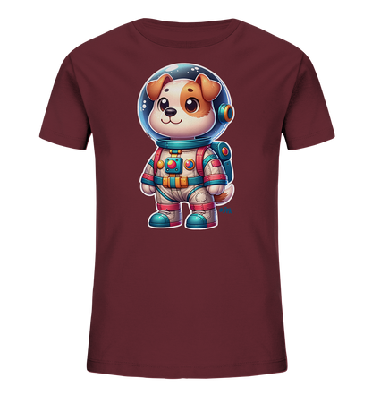 Onlineshop Shirts fuer Kinder - Das Bild zeigt ein Kinder-T-Shirt in einem kraeftigen Burgunderrot. Auf der Vorderseite ist eine detailreiche Grafik eines niedlichen Cartoon-Hundes abgebildet, der einen bunten Astronautenanzug traegt. Der Hund hat einen freundlichen Ausdruck und blickt geradeaus durch sein Helmvisier. Der Weltraumanzug ist farbenfroh gestaltet mit blauen, roten und beigen Akzenten und einem kleinen Rucksack.