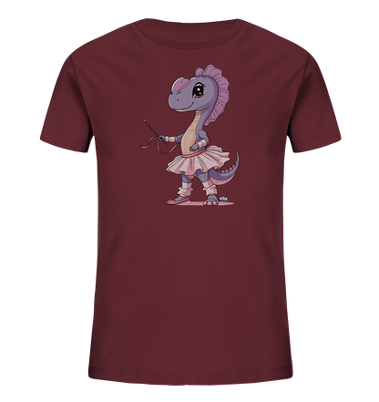 Onlineshop Shirts fuer Kinder - Das Bild zeigt ein dunkelrotes Kinder T-Shirt mit einem farbigen Aufdruck. Zu sehen ist eine lila Dinosaurierfigur in einem rosa Ballett-Outfit. Die Figur traegt ein Tutu, Ballettschuhe und haelt einen kleinen Stab mit Band in der Hand. Das Motiv ist im Cartoon-Stil gehalten und wirkt verspielt.