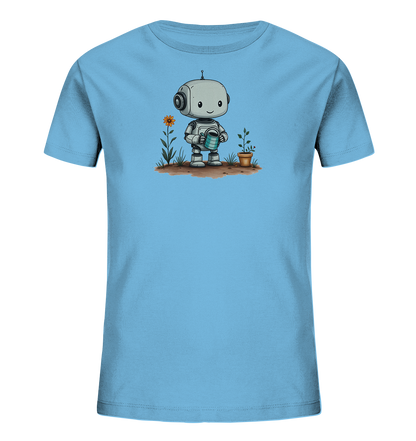 Onlineshop Shirts für Kinder - Das Bild zeigt ein hellblaues Kinder-T-Shirt mit einem aufgedruckten Motiv auf der Vorderseite. Das Motiv stellt einen freundlichen, cartoonhaften Roboter dar, der eine Gießkanne hält. Der Roboter steht in einer kleinen Gartenszene mit einer Blume und einer Pflanze in einem Topf. Dieses Design verleiht dem T-Shirt einen verspielten und umweltfreundlichen Charakter, ideal für Kinder, die sich für Roboter oder Natur interessieren.
