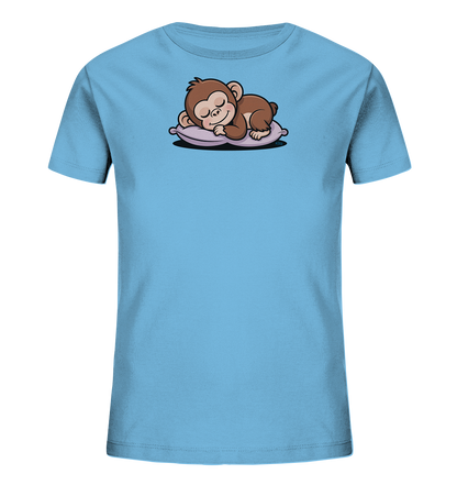 Onlineshop Shirts fuer Kinder - Das Bild zeigt ein hellblaues Kinder-T-Shirt. Auf der Vorderseite ist ein niedliches, braunes Äffchen abgebildet, das friedlich auf einem lila Kissen schlaeft. Das Motiv ist cartoonhaft und wirkt sehr beruhigend. Die Gesamtgestaltung ist einfach und ansprechend fuer Kinder.
