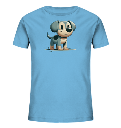 Onlineshop Shirts fuer Kinder - Das Bild zeigt ein hellblaues Kinder-T-Shirt. Darauf ist die Illustration eines kleinen, grauen und beigen Hundes zu sehen. Der Hund steht laechelnd auf einer gruenen Flaeche dargestellt. Das Motiv verleiht dem Shirt einen freundlichen und verspielten Look.