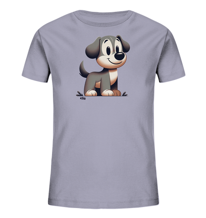 Onlineshop Shirts fuer Kinder - Das Bild zeigt ein Kinder-T-Shirt in einem hellen Graulila. Auf der Vorderseite befindet sich eine Illustration eines freundlichen, laechelnden Welpen im Cartoon-Stil. Der Hund sitzt auf einer stilisierten Bodenflaeche und hat dunkles und helles Fell. Das Design wirkt verspielt und ansprechend fuer Kinder.