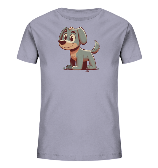 Onlineshop Shirts fuer Kinder - Das Bild zeigt ein hellviolettes T-Shirt mit einem niedlichen Comic-Motiv eines kleinen Hundes auf der Vorderseite. Der Hund ist blau-grau mit beigen Details, sitzt auf stilisiertem Gras und blickt freundlich nach vorne. Die Illustration ist farbenfroh und kindgerecht gestaltet.
