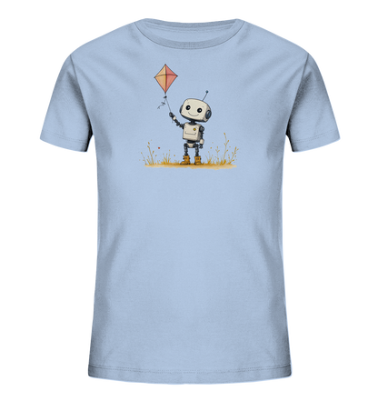 Onlineshop Shirts für Kinder - Das Bild zeigt ein hellblaues Kinder-T-Shirt mit einem aufgedruckten Motiv auf der Vorderseite. Die Illustration zeigt einen niedlichen, lächelnden Roboter in einem Feld mit gelbem Gras. Der Roboter hält die Schnur eines orangefarbenen Drachens in der Hand. Das Design ist farbenfroh und hat einen verspielten Charakter, der gut zu Kinderkleidung passt.