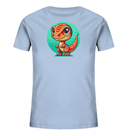 Onlineshop Shirts fuer Kinder - Das Bild zeigt ein hellblaues Kinder-T-Shirt mit einem niedlichen Comic-Dinosaurier auf der Vorderseite. Der orangefarbene Dinosaurier mit grossen Augen und roten Streifen steht vor einem tuerkisfarbenen Kreis. Die Illustration ist farbenfroh und kindgerecht gestaltet. Das T-Shirt ist schlicht und dient als Hintergrund fuer das Motiv.
