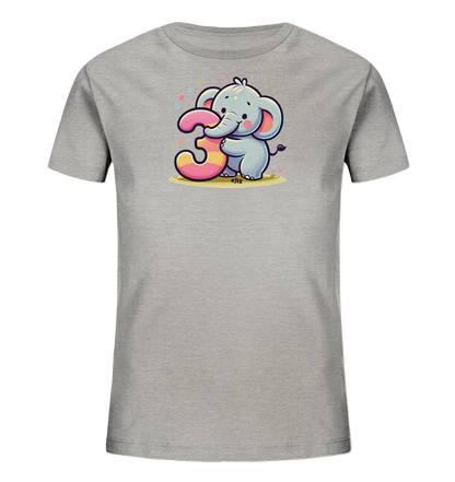 Onlineshop Shirts fuer Kinder - Das Bild zeigt ein graues Kinder-T-Shirt mit einem niedlichen Cartoon-Elefanten auf der Vorderseite. Der Elefant haelt die grosse, bunt gestreifte Zahl 3 mit seinem Ruessel fest. Kleine, farbige Punkte sind um das Motiv herum verstreut, was dem Design einen froehlichen Charakter verleiht. Die Illustration ist verspielt und ansprechend fuer junge Traeger.