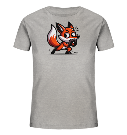 Onlineshop Shirts fuer Kinder - Das Bild zeigt ein graues Kinder-T-Shirt mit einem aufgedruckten, verspielten Fuchsmotiv. Der Fuchs hat leuchtend orangefarbenes Fell, grosse Augen und eine aufrechte Haltung. Er scheint bereit zu sein zu springen und hat einen neugierigen Ausdruck. Das Design ist farbenfroh und hat einen dynamischen, cartoonhaften Stil.