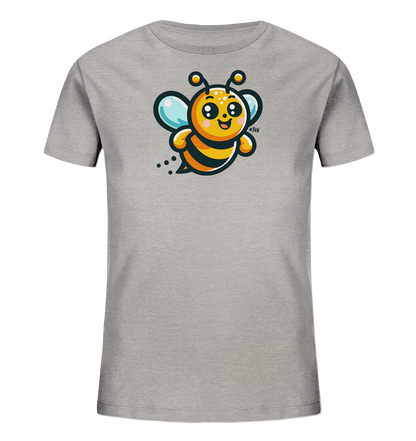 Onlineshop Shirts fuer Kinder - Das Bild zeigt ein graues Kinder-T-Shirt mit einer niedlichen Comic-Biene auf der Vorderseite. Die Biene hat einen gelb-schwarz gestreiften Koerper, blaue Fluegel und ein freundliches, laechelndes Gesicht. Sie scheint gerade im Flug dargestellt zu sein, mit kleinen Punkten hinter sich. Das Design wirkt verspielt und froehlich.
