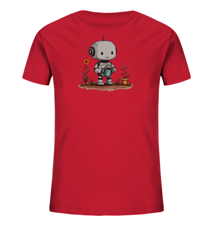Onlineshop Shirts für Kinder - Das Bild zeigt ein leuchtend rotes Kinder-T-Shirt auf schwarzem Hintergrund. Auf der Vorderseite des Shirts befindet sich eine farbige Illustration eines niedlichen Roboters. Der Roboter hält eine blaue Gießkanne und gießt eine kleine Pflanze in einem Terrakottatopf. Neben der Pflanze wächst eine einzelne Sonnenblume aus brauner Erde, was dem Design eine fröhliche und naturverbundene Szene verleiht.