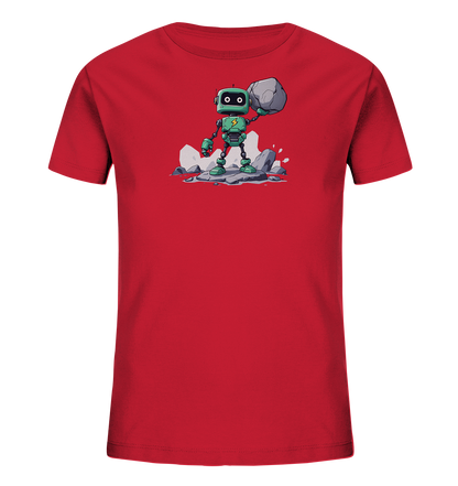 Onlineshop Shirts für Kinder - Das Bild zeigt ein rotes Kinder-T-Shirt mit einem zentralen Motiv eines grünen Roboters. Der Roboter steht auf einem Haufen grauer Felsen und hält einen großen Stein über seinem Kopf in die Höhe. Er hat quadratische Augen und eine gelbe Blitz-Grafik auf seiner Brust. Das Design wirkt dynamisch und zeigt den Roboter in einer kraftvollen Pose, umgeben von spritzendem Wasser und zerbrochenen Felsen.