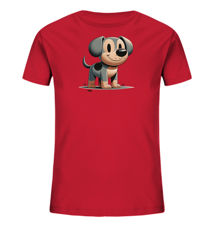Onlineshop Shirts fuer Kinder - Das Bild zeigt ein rotes Kinder-T-Shirt. Auf der Vorderseite ist eine niedliche Cartoon-Grafik eines Hundes zu sehen. Der Hund hat graues Fell mit dunklen Flecken, grosse Ohren und ein freundliches Laecheln. Er steht auf einem hellgrauen Bereich, der Boden darstellt, mit gruenen Grasbuescheln.