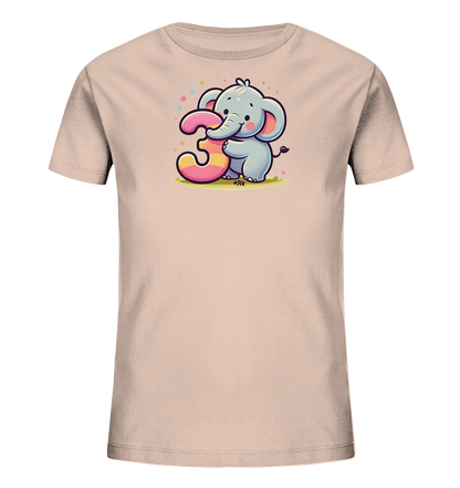 Onlineshop Shirts fuer Kinder - Hellrosa T-Shirt mit suessem Elefanten, der die Zahl Drei haelt. Die grosse Zahl ist bunt gestreift in Pink und Gelb. Bunte Punkte schweben ueber dem Elefanten. Ein froehliches Design fuer kleine Kinder.