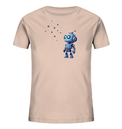 Onlineshop Shirts für Kinder - Das Bild zeigt ein helles, cremefarbenes oder sehr hellrosa Kinder-T-Shirt. Auf der Vorderseite ist ein niedlicher, blauer Cartoon-Roboter abgebildet. Der Roboter steht aufrecht und blickt nach oben links, wo eine Ansammlung von kleinen blauen Sternen und Punkten zu sehen ist. Das Design wirkt insgesamt verspielt und freundlich, passend für Kinderbekleidung.