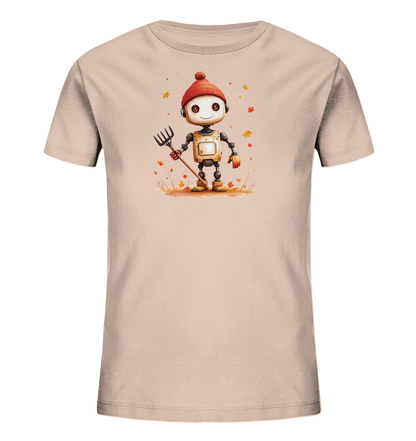 Onlineshop Shirts für Kinder - Das Bild zeigt ein hellrosafarbenes T-Shirt für Kinder mit einem detaillierten Print auf der Vorderseite. Die Illustration stellt einen freundlichen, kleinen Roboter dar, der eine rote Strickmütze und orangefarbene Handschuhe trägt. Der Roboter steht in einer Szene mit herabfallendem Herbstlaub und hält einen Rechen in der Hand. Das Design vermittelt eine herbstliche und hilfsbereite Stimmung, passend für die kühlere Jahreszeit.