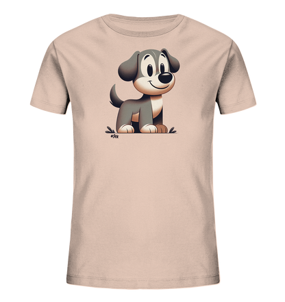 Onlineshop Shirts fuer Kinder - Das Bild zeigt ein Kinder-T-Shirt in einem hellen Pfirsichton. Darauf ist eine freundliche, cartoonartige Illustration eines Hundes zu sehen. Der Hund sitzt aufrecht, hat grosse Augen und ein Laecheln. Das Motiv ist in Grau- und Beigetoenen gehalten und wirkt verspielt.