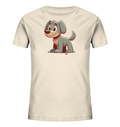 Onlineshop Shirts fuer Kinder - Das Bild zeigt ein hellbeiges Kinder-T-Shirt. Darauf ist ein freundlicher Cartoon-Hund abgebildet. Der Hund hat graues Fell, grosse Augen und sitzt laechelnd auf einer gruenen Wiese.