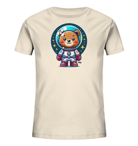Onlineshop Shirts fuer Kinder - Das Bild zeigt ein cremefarbenes Kinder-T-Shirt mit einem niedlichen Astronauten-Baer-Motiv. Der Cartoon-Baer traegt einen weissen Raumanzug mit roten Akzenten und einen Helm. Dahinter ist ein dunkler Kreis mit Sternen und Punkten abgebildet, der das Weltall darstellt. Das Design wirkt verspielt und fantasievoll.