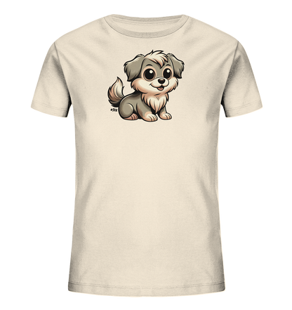 Onlineshop Shirts fuer Kinder - Das Bild zeigt ein hellbeiges Kinder-T-Shirt. Auf der Vorderseite ist eine niedliche, cartoonhafte Illustration eines kleinen Hundes zu sehen. Der Hund hat flauschiges, graues und beiges Fell, grosse, freundliche Augen und sitzt in einer aufrechten Position.