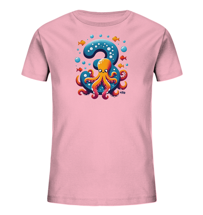 Onlineshop Shirts fuer Kinder - Das Bild zeigt ein pinkes Kinder-T-Shirt. Auf der Vorderseite ist ein grosses blaues '3' zu sehen, auf dem ein freundlicher, orangefarbener Oktopus sitzt. Um das Motiv schwimmen kleine Fische und Blasen. Es ist ein verspieltes Design.
